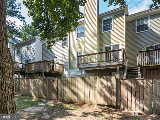 1447 Chatham Ct, Crofton, MD 21114 - rear view of house with a deck and a chimney