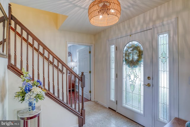 45 S Shore Dr, Dover, DE 19901 - entrance foyer featuring stairway, healthy amount of natural light, and a chandelier