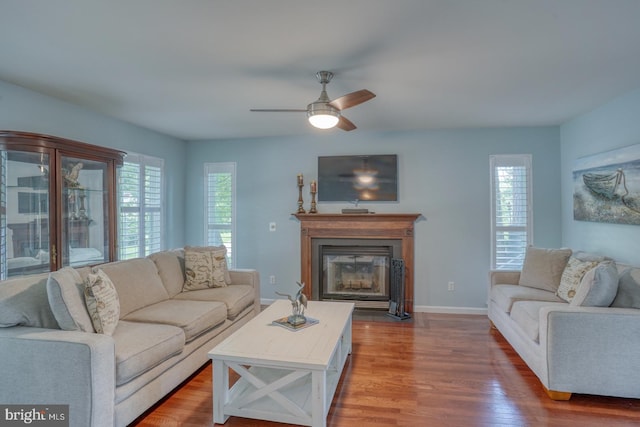 45 S Shore Dr, Dover, DE 19901 - living area with wood finished floors, ceiling fan, a fireplace with flush hearth, and baseboards