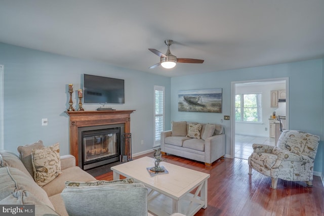 45 S Shore Dr, Dover, DE 19901 - living area with a ceiling fan, baseboards, wood finished floors, and a glass covered fireplace