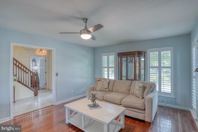45 S Shore Dr, Dover, DE 19901 - living room with plenty of natural light, stairs, a ceiling fan, and wood finished floors