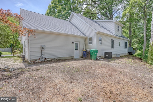 45 S Shore Dr, Dover, DE 19901 - back of house featuring cooling unit and a shingled roof