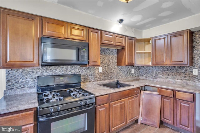 7175 Lee Ave, Pennsauken, NJ 08110 - kitchen featuring black appliances, decorative backsplash, light countertops, and brown cabinets