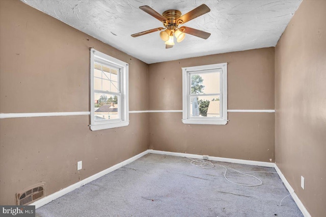 7175 Lee Ave, Pennsauken, NJ 08110 - spare room featuring carpet flooring, plenty of natural light, a ceiling fan, and baseboards