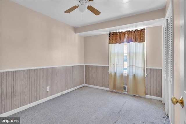 7175 Lee Ave, Pennsauken, NJ 08110 - carpeted empty room featuring a ceiling fan, a wainscoted wall, and baseboards