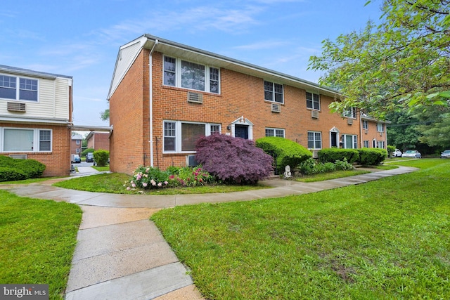 132 The Orchards Unit I, East Windsor, NJ 08520 - view of front facade featuring a front yard and brick siding