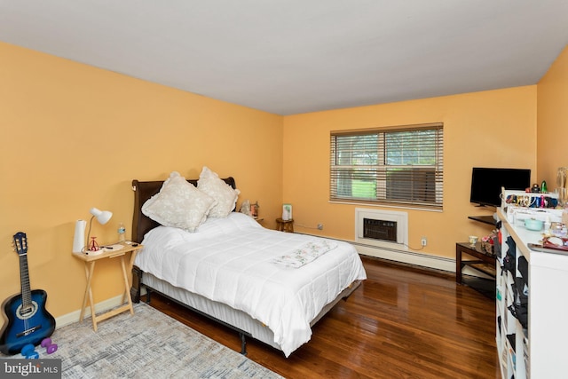132 The Orchards Unit I, East Windsor, NJ 08520 - bedroom with wood finished floors, baseboard heating, baseboards, and a wall mounted air conditioner