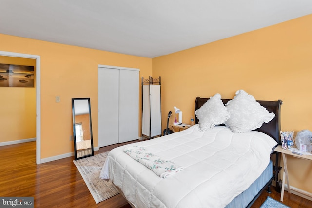 132 The Orchards Unit I, East Windsor, NJ 08520 - bedroom with wood finished floors, baseboards, and a closet