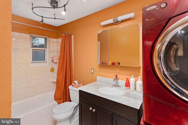132 The Orchards Unit I, East Windsor, NJ 08520 - bathroom featuring washer / clothes dryer, vanity, shower / tub combo, and toilet