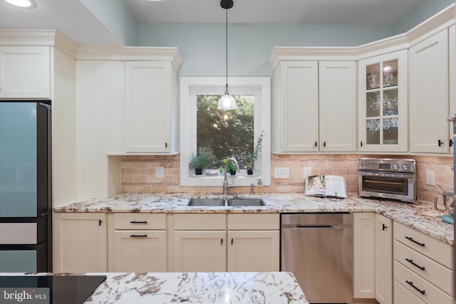 3134 Clayborne Ave, Alexandria, VA 22306 - kitchen featuring a sink, stainless steel appliances, tasteful backsplash, glass insert cabinets, and pendant lighting