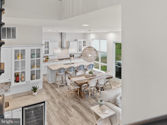 41 Beach Club Ave, Ocean View, DE 19970 - dining space with wine cooler, light wood-type flooring, a dry bar, and recessed lighting