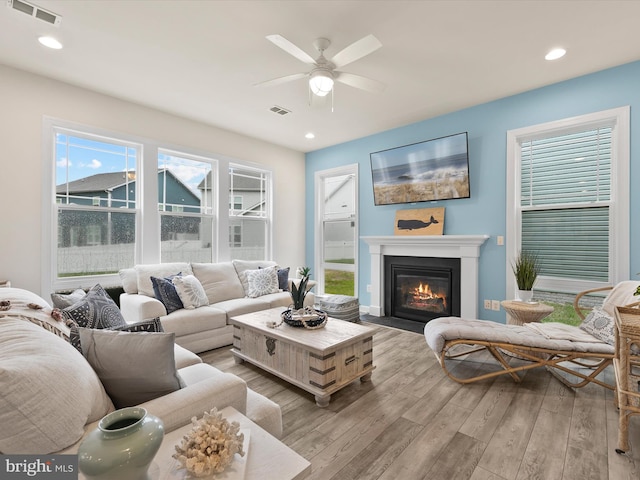 41 Beach Club Ave, Ocean View, DE 19970 - living room with wood finished floors, a ceiling fan, a glass covered fireplace, and recessed lighting