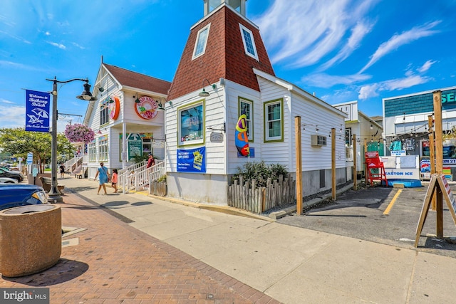 41 Beach Club Ave, Ocean View, DE 19970 - view of building exterior with a wall mounted air conditioner
