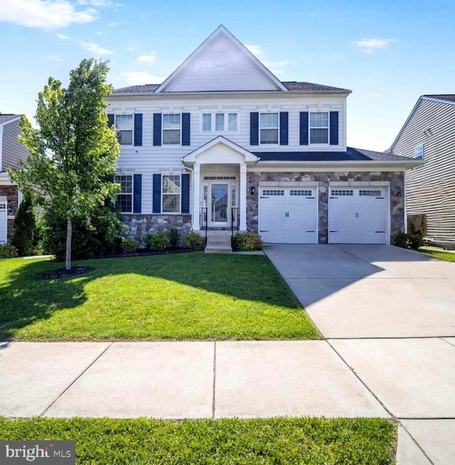 4504 Eden Park Ln, Upper Marlboro, MD 20772 - view of front of house featuring stone siding, driveway, a garage, and a front lawn