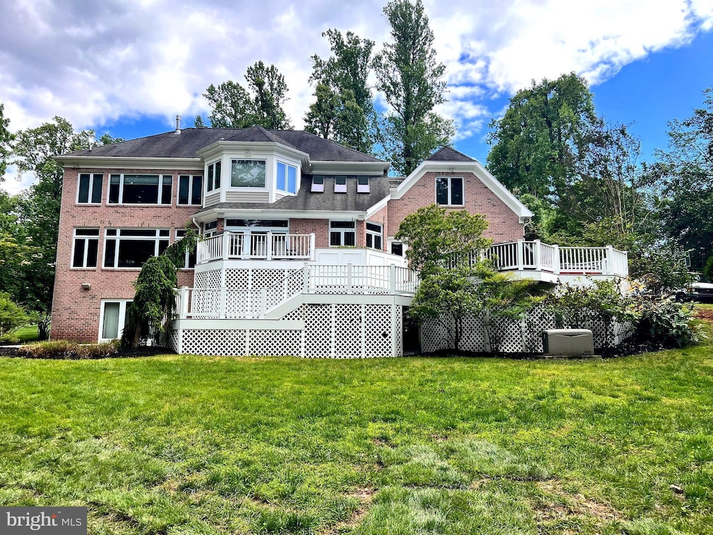2610 Chestnut Woods Ct, Reisterstown, MD 21136 - rear view of house featuring brick siding, a yard, a wooden deck, and stairs