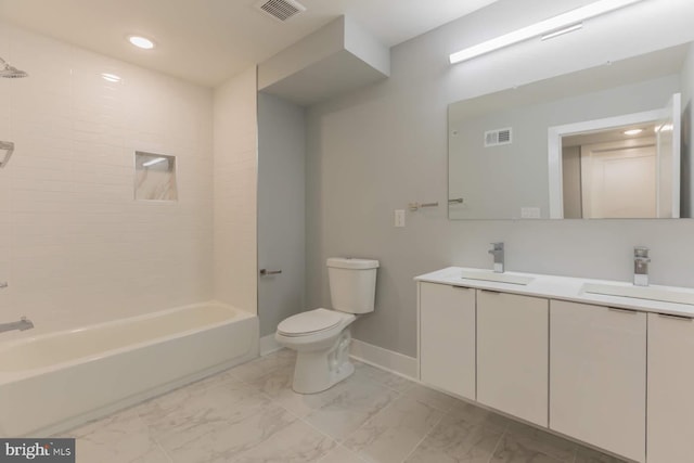 1947 N 33rd St, Philadelphia, PA 19121 - bathroom featuring marble finish floors, toilet, double vanity, baseboards, and shower / bath combination