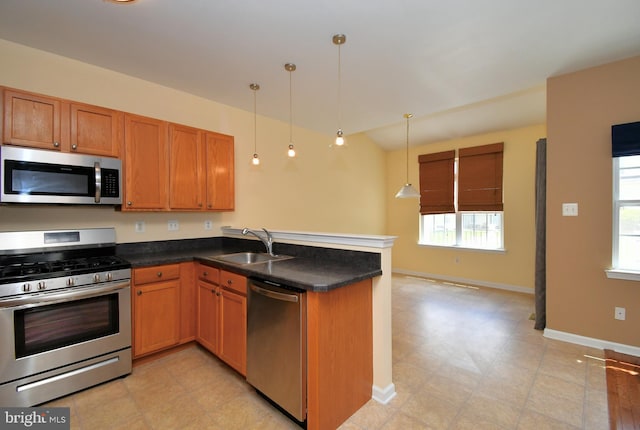 1664 Brynne Ln, Pottstown, PA 19464 - kitchen with appliances with stainless steel finishes, a sink, a peninsula, plenty of natural light, and lofted ceiling