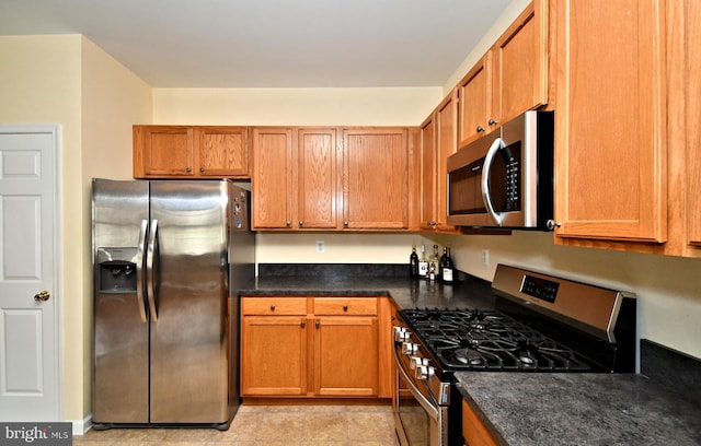 1664 Brynne Ln, Pottstown, PA 19464 - kitchen featuring stainless steel appliances and brown cabinets