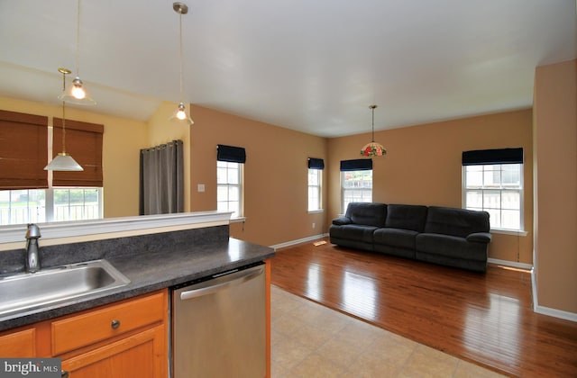 1664 Brynne Ln, Pottstown, PA 19464 - kitchen with dishwasher, a sink, dark countertops, and healthy amount of natural light