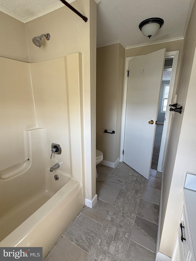 16 W Ninth St, Waynesboro, PA 17268 - full bathroom featuring a textured ceiling, toilet, crown molding, bathtub / shower combination, and baseboards