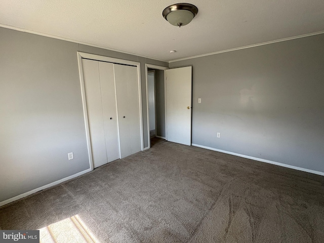 16 W Ninth St, Waynesboro, PA 17268 - unfurnished bedroom featuring ornamental molding, a closet, carpet, and baseboards