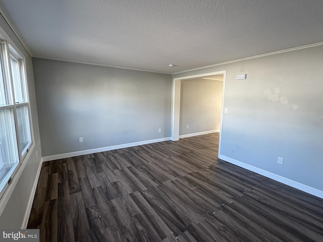 16 W Ninth St, Waynesboro, PA 17268 - unfurnished room with dark wood-style floors, a textured ceiling, ornamental molding, and baseboards