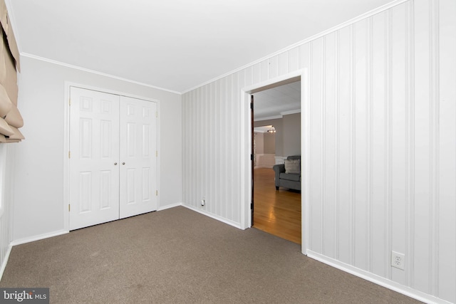 449 Audubon Ave, Audubon, NJ 08106 - unfurnished bedroom featuring crown molding, baseboards, carpet flooring, and a closet
