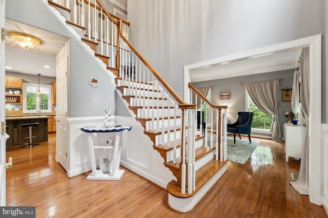 45 Saint Marys Ln, Stafford, VA 22556 - stairway featuring hardwood / wood-style flooring and crown molding