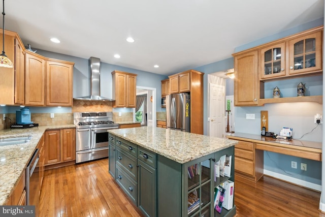 45 Saint Marys Ln, Stafford, VA 22556 - kitchen featuring wall chimney exhaust hood, stainless steel appliances, open shelves, light wood-style floors, and a kitchen island
