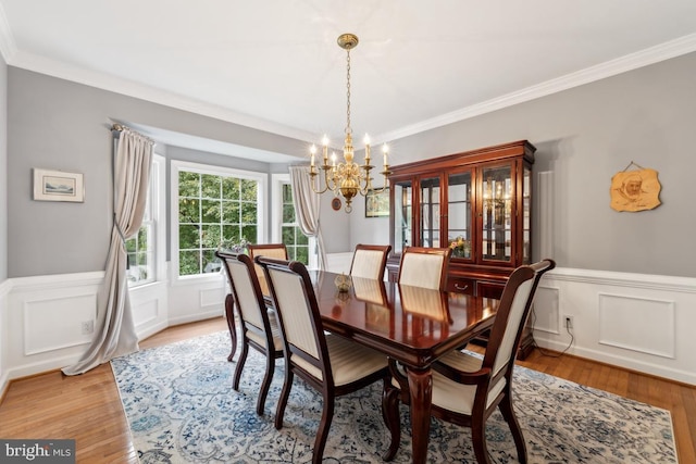 45 Saint Marys Ln, Stafford, VA 22556 - dining space featuring a chandelier, a wainscoted wall, crown molding, and light wood finished floors