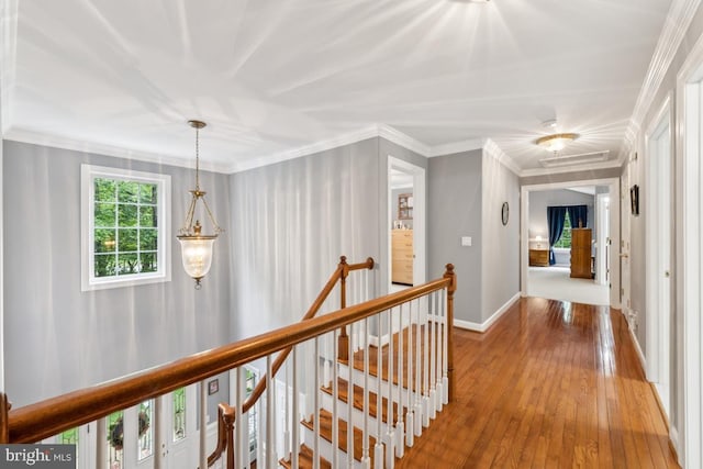 45 Saint Marys Ln, Stafford, VA 22556 - hallway featuring an upstairs landing, wood-type flooring, baseboards, and crown molding