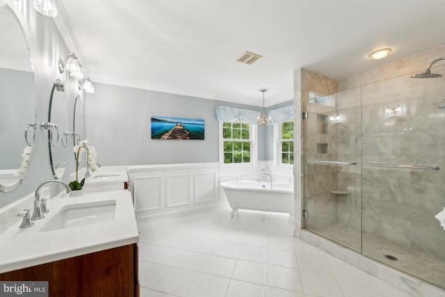 45 Saint Marys Ln, Stafford, VA 22556 - bathroom featuring crown molding, a shower stall, tile patterned flooring, double vanity, and a freestanding tub