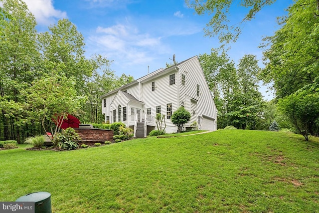 45 Saint Marys Ln, Stafford, VA 22556 - rear view of house with a yard, an attached garage, and a deck