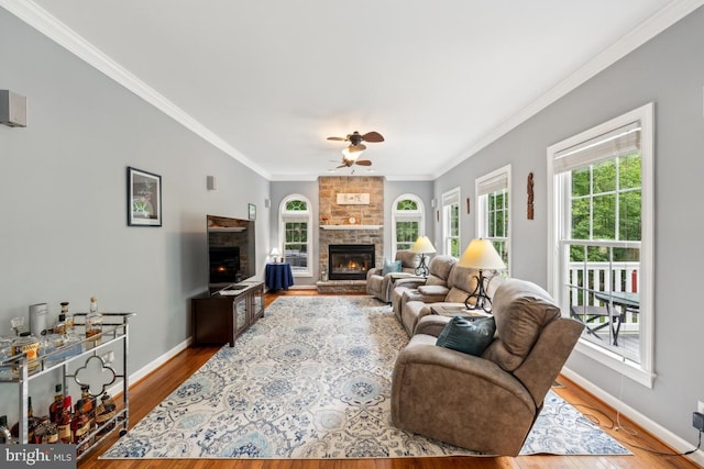 45 Saint Marys Ln, Stafford, VA 22556 - living area with a fireplace, a ceiling fan, crown molding, baseboards, and wood finished floors