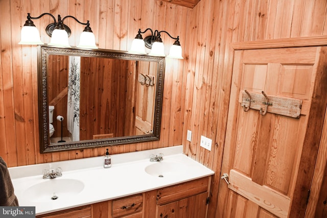 194 Thornberry Ln, Blakeslee, PA 18610 - bathroom featuring wood walls, double vanity, and toilet