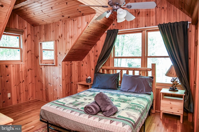 194 Thornberry Ln, Blakeslee, PA 18610 - bedroom with vaulted ceiling, wood finished floors, and wooden walls