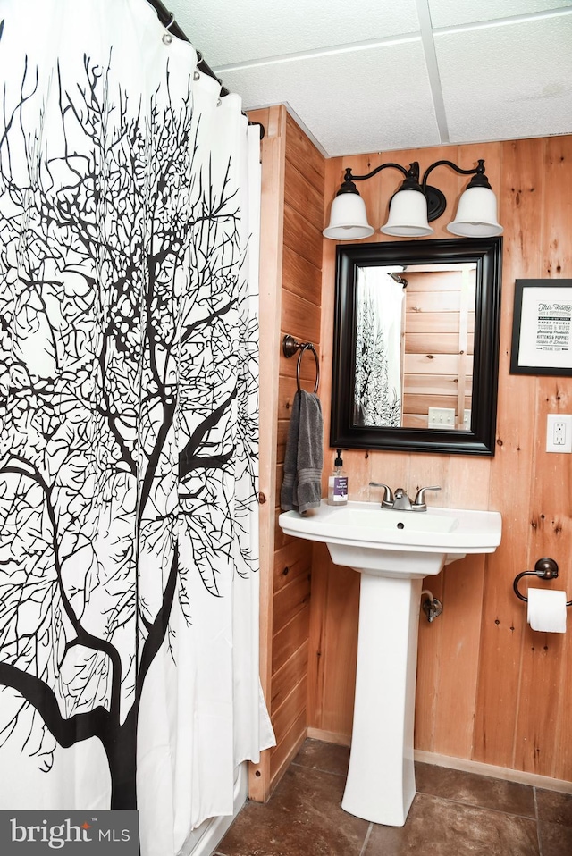 194 Thornberry Ln, Blakeslee, PA 18610 - full bathroom with wooden walls, curtained shower, and baseboards
