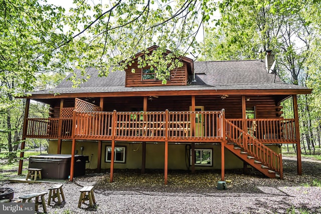 194 Thornberry Ln, Blakeslee, PA 18610 - back of house with a hot tub, log siding, a deck, and a shingled roof