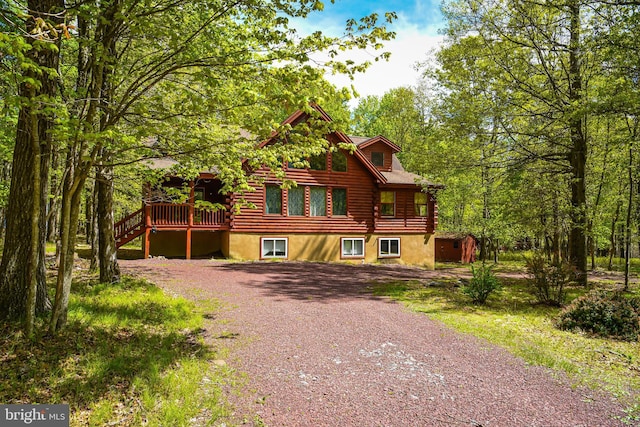 194 Thornberry Ln, Blakeslee, PA 18610 - log-style house featuring log siding, a wooden deck, driveway, and stairs