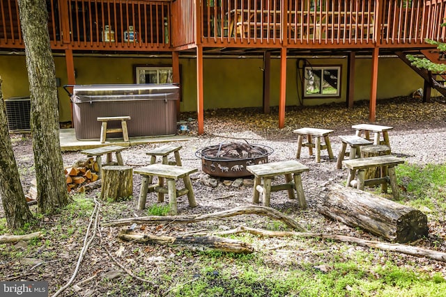 194 Thornberry Ln, Blakeslee, PA 18610 - view of patio / terrace with an outdoor fire pit, a hot tub, a wooden deck, and central air condition unit