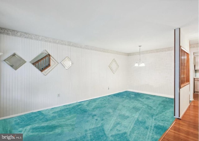 38 Western Winds Cir Unit 38, Baltimore, MD 21244 - carpeted spare room featuring a chandelier, baseboards, and wood finished floors