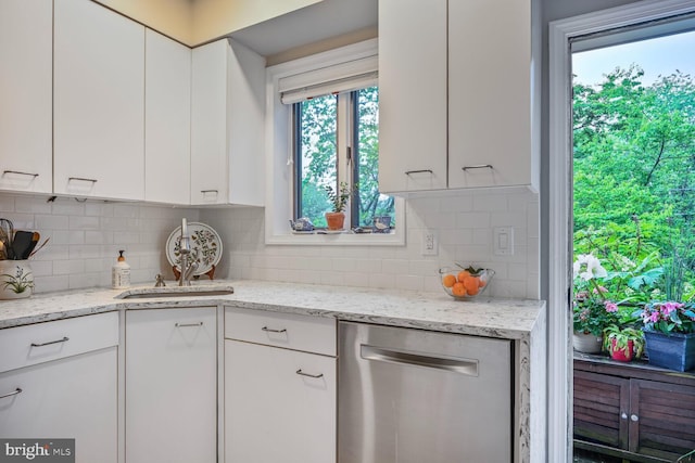 5408 Wehawken Rd, Bethesda, MD 20816 - kitchen featuring stainless steel dishwasher, white cabinetry, backsplash, and light stone counters