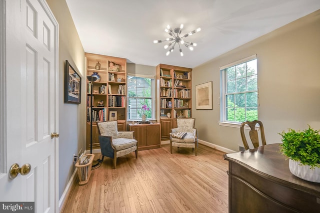 5408 Wehawken Rd, Bethesda, MD 20816 - sitting room with a chandelier, baseboards, and light wood-type flooring