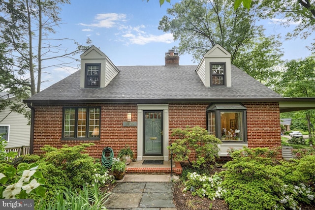 5408 Wehawken Rd, Bethesda, MD 20816 - view of front of property featuring brick siding, a shingled roof, and a chimney