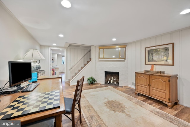 5408 Wehawken Rd, Bethesda, MD 20816 - office featuring wood finished floors, recessed lighting, and a fireplace with flush hearth