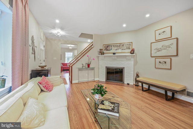5408 Wehawken Rd, Bethesda, MD 20816 - living area with wood finished floors, baseboards, recessed lighting, and a glass covered fireplace