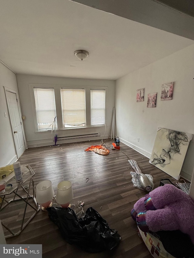 1512 Lindley Ave, Philadelphia, PA 19141 - unfurnished living room featuring wood finished floors, baseboards, and a baseboard heating unit