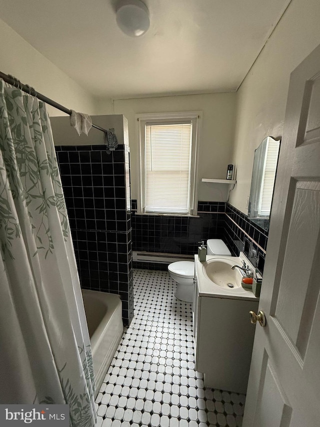 1512 Lindley Ave, Philadelphia, PA 19141 - bathroom with vanity, tile patterned floors, tile walls, toilet, and shower / tub combo