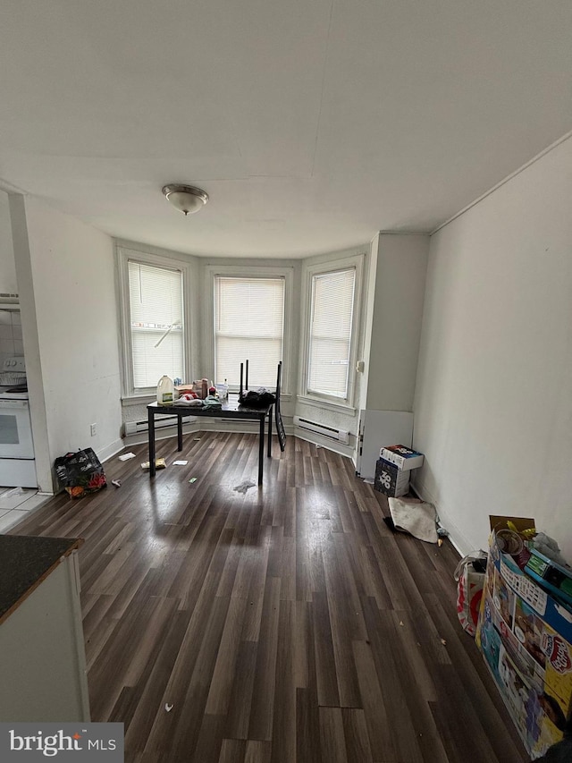1512 Lindley Ave, Philadelphia, PA 19141 - home office with dark wood-type flooring and a baseboard heating unit