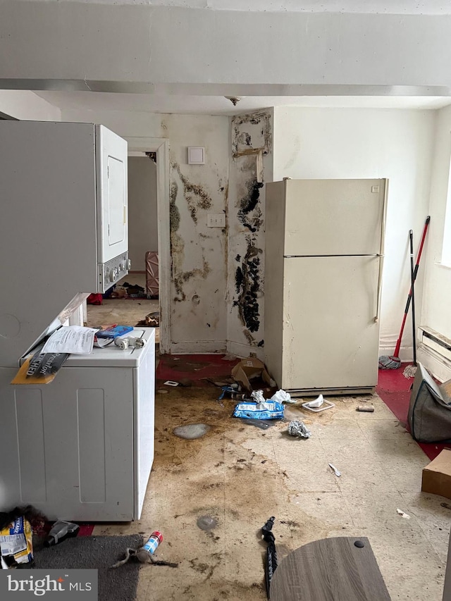 1512 Lindley Ave, Philadelphia, PA 19141 - kitchen featuring freestanding refrigerator and stacked washer / drying machine